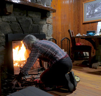 Building a fire in a stone fireplace